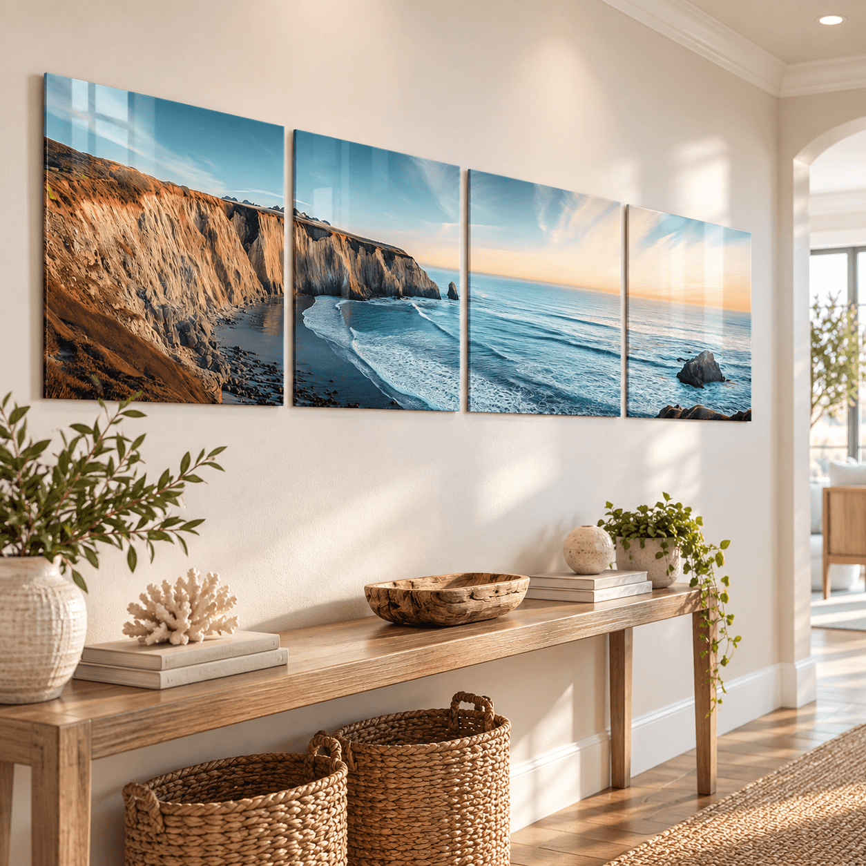 Sunset coastline glass wall art panels lining a hallway above a wooden console table
